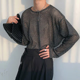 MODEFREAKのモノトーンメッシュトップスの画像1